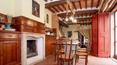 Toscana Immobiliare - The farmhouse features terracotta floors, wooden beams and exposed brick arches