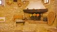 Toscana Immobiliare - stone walls, fireplace For sale in Cortona restored stone country house portion