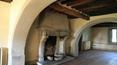Toscana Immobiliare - living area with fireplace of the Old residential complex surrounded by a big park 
