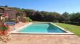 Toscana Immobiliare - Swimming pool of the elegant villa in sardinia surrounded by a luxuriant garden with swimming pool