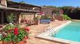 Toscana Immobiliare - Swimming pool of the elegant villa in sardinia surrounded by a luxuriant garden with swimming pool
