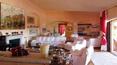 Toscana Immobiliare - living room of the elegant villa in sardinia surrounded by a luxuriant garden with swimming pool