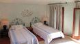 Toscana Immobiliare - Bedroom of the elegant villa in sardinia surrounded by a luxuriant garden with swimming pool