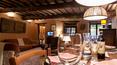 Toscana Immobiliare - The residence has a large open plan sitting room and dining area, with comfortablesofas, rural wooden dining table and benches
