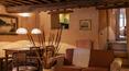 Toscana Immobiliare - The residence has a large open plan sitting room and dining area, with comfortablesofas, rural wooden dining table and benches