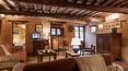 Toscana Immobiliare - The residence has a large open plan sitting room and dining area, with comfortablesofas, rural wooden dining table and benches