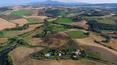 Toscana Immobiliare - Farm estate with vineyards for sale in Montalcino Tuscany