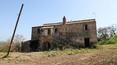 Toscana Immobiliare - Farmhouse to be restored for sale in Civita di Bagnoregio with a panoramic view of the town of Civita