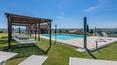 Toscana Immobiliare - Framed by the rolling hills of the countryside around Siena, this beautiful property in Montalcino is for sale.