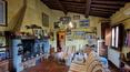 Toscana Immobiliare - Attraverso una tipica scala esterna in pietra si raggiunge l’appartamento padronale composto da un’ampia zona living con doppio salone, cucina, disimpegno,  tre camere da letto, due bagni, studio e lavanderia.