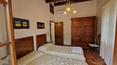 Toscana Immobiliare - Farmhouse with a view for sale near Cortona, divided into two apartments, with swimming pool and 2.5 ha of land.