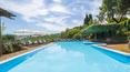 Toscana Immobiliare - The farmhouse is surrounded by gardens and 2.6 hectares of parkland, consisting of woods and meadows, with a pond, a large swimming pool, barbecues, 3 wells, and a forest path for walks.