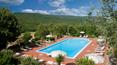 Toscana Immobiliare - The farmhouse is located on the slopes of a hilly area covered with holm oaks, chestnut trees, olive trees and centuries-old oaks.