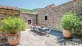 Toscana Immobiliare - Property for sale in Tuscany with views of the Val d'Orcia, two buildings, annex, swimming pool, garden and 50 hectares of land.