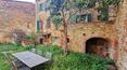 Toscana Immobiliare - Stone building with panoramic garden for sale in Montisi Trequanda Siena Tuscany