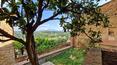 Toscana Immobiliare - Stone building with panoramic garden for sale in Montisi Trequanda Siena Tuscany