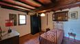Toscana Immobiliare - The interiors feature terracotta floors, brick arches and ceilings with exposed wooden beams