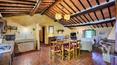 Toscana Immobiliare - The property has typical Tuscan farmhouse features such as exposed stonework, wooden beams and terracotta floors