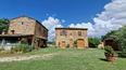 Toscana Immobiliare - In Tuscany, between Siena and Arezzo for sale country house with land and vineyard. Typical Tuscan property for sale with 2 farmhouses