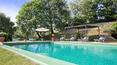 Toscana Immobiliare - The property features a porch equipped for outdoor dining with barbecue and wood-burning oven
