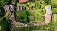 Toscana Immobiliare - Ancient Tuscan stone property, consisting of two houses and a ruin, arranged in the original circular structure of the fortress