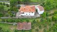 Toscana Immobiliare - Property consisting of a villa, 2 annexes and 5.4 hectares of land with olive grove, vineyard, arable land and woodland for sale in Tuscany