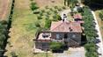 Toscana Immobiliare - La proprietà è composta da una casa di campagna, una rimessa e un giardino con piante di olivo