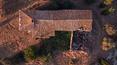 Toscana Immobiliare - The house boasts a charming loggia and is surrounded by 1 ha of land with olive trees and a pond