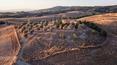 Toscana Immobiliare - Country house to be restored with panoramic views, annexe and 1 ha of land with olive grove and pond