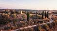 Toscana Immobiliare - The farmhouse is framed by the sinuous hills of the Siena countryside