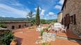 Toscana Immobiliare - The property features a garden with a panoramic swimming pool