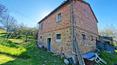 Toscana Immobiliare - Panoramic farmhouse with annexes and 6.5 ha of land for sale near Monticchiello, in the heart of the Val d'Orcia, Tuscany