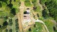 Toscana Immobiliare - Typical Tuscan stone farmhouse undergoing renovation in the beautiful hills of Lucignano