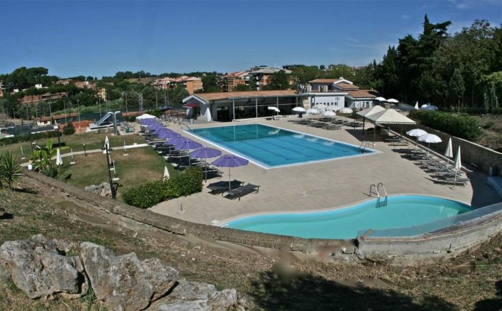 Toscana Immobiliare - panoramic view of the hotel for sale in Rome with sports center and shops inside